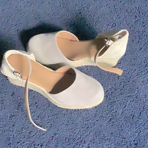 Women’s size 8.5 wedges with ankle strap.